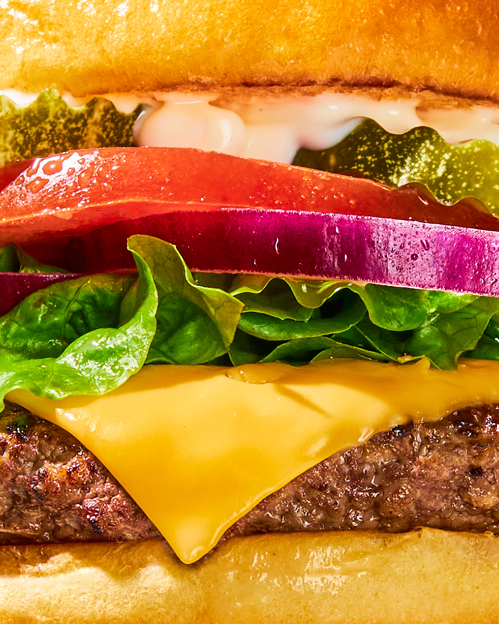close up cheeseburger by los angeles food photographer maddie eickhoff